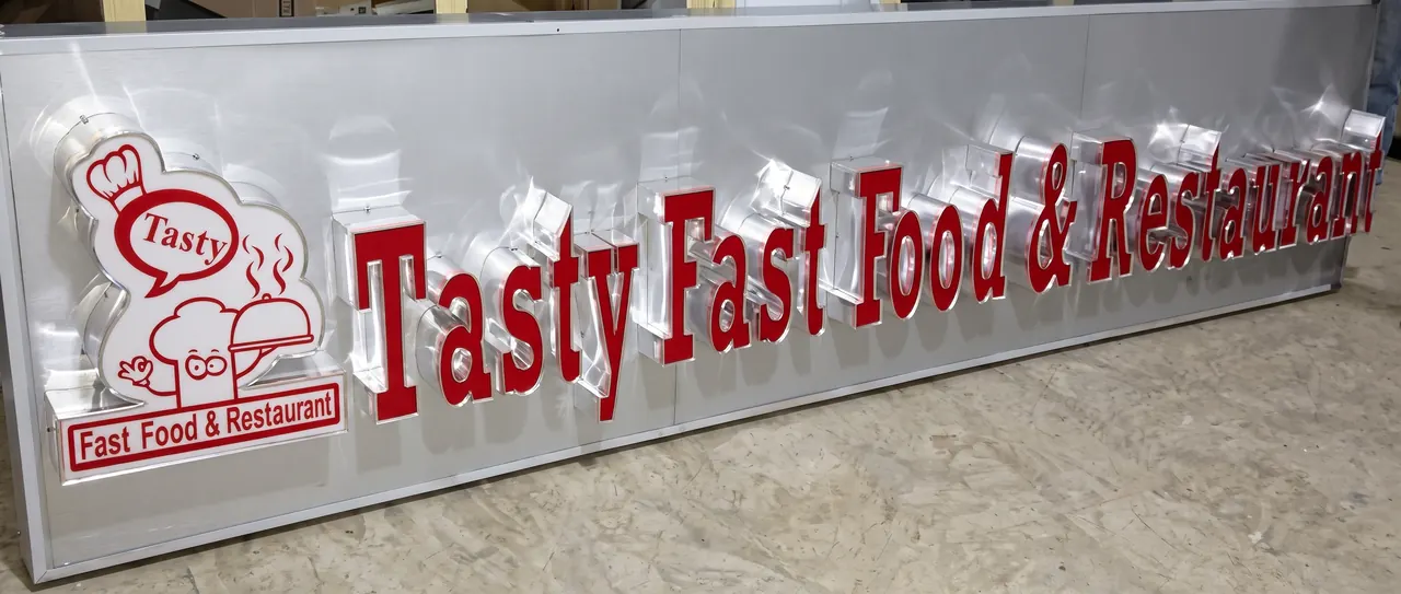 Red built-up letters reading Tasty Fast Food and Restaurant on a silver aluminium fascia.